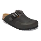 Zueco Birkenstock modelo Boston Nova, color negro, con diseño técnico que combina cuero y tejido sintético. Cuenta con una hebilla metálica ajustable sobre el empeine y la clásica plantilla de corcho anatómica con suela dentada.