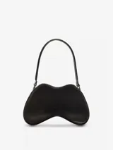 Bolso de hombro para mujer de Diesel, color negro, con forma orgánica y brillante, similar a un control de videojuegos. Posee un asa de hombro negra y un pequeño dije metálico con logo en el frente.
