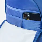 Mochila Rip Curl de 30 litros confeccionada en poliéster reciclado, color azul. Presenta un compartimento principal con cierre, bolsillo frontal con estampa circular de la marca y una flor, correas ajustables y manija superior.