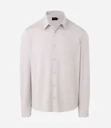 Camisa masculina de manga larga con cuello inglés y cierre frontal abotonado. Confeccionada en tejido de poliamida con tecnología performance, que ofrece elasticidad, secado rápido y resistencia a las arrugas.
