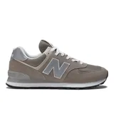 Championes New Balance 574 color gris con detalles en blanco, confeccionados en gamuza y malla, con logo "N" característico en los laterales y entresuela ENCAP.