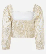Blusa cropped de mangas 3/4, confeccionada en viscolino con 20% de lino, con escote cuadrado, elásticos en las sisas y puños. Prenda con estampa abstracta de foil.