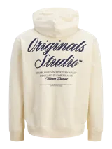 Buzo con capucha de calce holgado, color crema, confeccionado en tejido loopback con interior levemente afelpado. Presenta bolsillo frontal tipo canguro, puños y ruedo acanalados, y estampado con texto en el pecho.