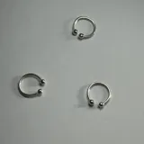 Aros trepadores de plata 925 con forma de herradura y bolitas en los extremos.