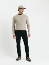 Sweater de punto con escote en V y manga larga, confeccionado en tejido acrílico con textura suave.