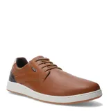 Zapato casual de hombre color marrón coñac, con cordones al tono, suela blanca de goma y detalle de cuero texturizado en el talón.