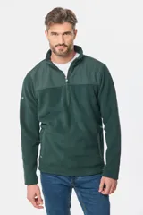 Buzo de micro polar con interior térmico, cuello alto y cierre frontal parcial. Presenta paneles de taslón al tono en el frente y cuello, con bolsillos laterales con cierre y detalle de logo en la manga.