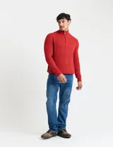 Sweater de punto inglés color verde, con cuello alto y cierre frontal parcial metálico. Diseño de manga larga con puños y ruedo acanalados.