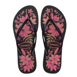 Sandalias tipo ojota Havaianas modelo Slim Organic, color negro con estampado floral en tonos rosados y naranjas. Presentan tiras finas de goma con textura y logo de la marca en relieve.