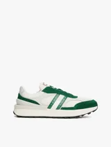 Zapatillas Tommy Jeans de corte bajo, color blanco con detalles en verde. Capellada de ante y malla, con logo de la marca en el lateral. Suela de goma dentada.