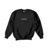 Buzo de cuello redondo en color negro, con diseño de estampado gótico en el centro del pecho. Presenta un corte holgado y puños elásticos en mangas y ruedo.