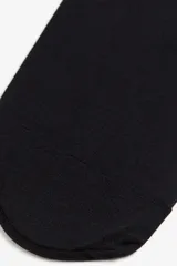 Pack de 4 medias negras traslúcidas de 20 denier, con cintura elástica y acabado mate.