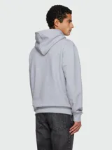 Buzo con capucha Balmain de corte holgado, confeccionado en algodón gris, con estampado frontal del logo de la marca en color negro.