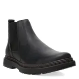 Botas tipo Chelsea de cuero negro con paneles elásticos laterales y suela de goma dentada. Diseño de punta redonda y estilo casual.