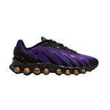Championes Nike Air Max Dn8 de diseño moderno y deportivo. Presentan una combinación de colores en negro y violeta, con una suela técnica que incorpora cápsulas de aire visibles en tono bronce para mayor amortiguación.