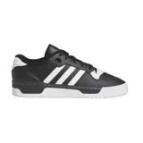 Championes adidas Rivalry Low de corte bajo, con diseño clásico en color negro y detalles en blanco, incluyendo las tres tiras laterales características de la marca y suela de goma.