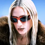 Lentes de sol con montura envolvente color rojo mate y detalles metálicos de líneas orgánicas. Cuentan con lentes de nylon color marrón con protección UV400 categoría 3.
