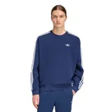 Buzo Adidas de cuello redondo en color azul, con diseño oversize y ajuste relajado. Presenta el logo Trefoil bordado en el pecho y las icónicas tres tiras blancas en las mangas.