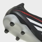 Championes de fútbol Adidas Copa Pure IV League para terreno firme. Diseño en color negro con las icónicas tres tiras blancas laterales y detalles en rojo. Presentan tecnología FUSIONFEEL para mayor comodidad y tracción optimizada.