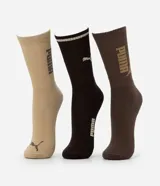 Kit de tres pares de medias deportivas de caña larga Puma en tonos neutros: beige, negro y marrón, con detalles de logo y rayas.