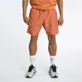Short de baño Umbro color naranja con estampado de rombos en relieve.