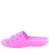 Sandalias Crocs Classic Slide rosadas, con diseño perforado en la parte superior y logo de la marca en el lateral.