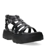 Sandalias tipo franciscanas de cuero negro con plataforma track y doble tira con hebilla metálica en el tobillo.
