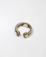 Anillo abierto de plata 925 con doble banda trenzada y apliques dorados con circonias blancas.