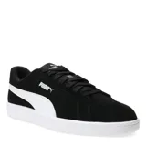 Championes urbanos Puma modelo Smash 3.0, color negro con la icónica franja lateral en blanco. Confeccionados en gamuza, cuentan con cierre de cordones y suela de goma blanca.