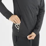 Campera Salomon Essential Lightwarm Hybrid para mujer, de color negro con cierre completo y cuello alto. Combina tejido ripstop y forro polar para mayor calidez y transpirabilidad.