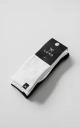 Pack de dos pares de medias de algodón con tejido acanalado, una en color blanco y otra en color negro. Presentan una etiqueta pequeña con el logo de tijeras en el borde superior.
