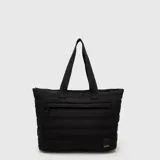 Tote bag acolchada de color azul marino, con diseño de costuras horizontales, doble asa superior y bolsillo frontal con cierre. Incluye compartimento interno para laptop.