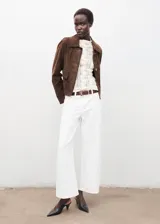 Top de tejido de punto calado con cuello perkins y manga larga, de diseño entallado.