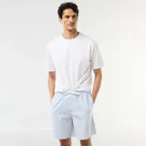 Pack de dos shorts de descanso con diseño de rayas verticales, cintura elástica con cordón de ajuste y bolsillos laterales.