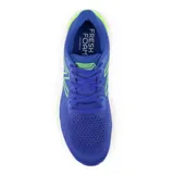 Championes de running New Balance Vongo v5 para hombre, color azul con detalles en verde.