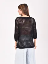 Buzo de punto calado color verde lima, con escote en V y mangas 3/4.