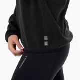 Buzo polar de mujer con cierre frontal parcial, cuello alto y manga larga. Confeccionado en microfleece de poliéster reciclado, cuenta con puños elásticos y logo de la marca bordado en el pecho.
