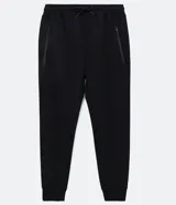 Pantalón jogger deportivo de corte ajustado, con cintura elástica y cordón de ajuste. Cuenta con bolsillos laterales con cierre y puños elásticos en el bajo. Diseño liso en color negro.