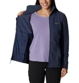 Campera polar de mujer con cierre completo frontal, cuello alto y bolsillos laterales. Presenta un diseño entallado con paneles laterales en un tono de azul más oscuro y el logo de la marca bordado en el pecho.