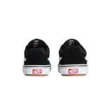 Championes Vans modelo Walker Wafflecup, de diseño clásico con capellada de gamuza y lona en color negro. Presenta la icónica banda lateral blanca, suela de goma vulcanizada con tecnología Wafflecup y detalles en color goma en la base.