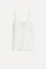 Top lencero blanco de viscosa con escote redondo y tirantes finos.