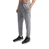 Pantalón de jogging Nike Therma, color gris jaspeado, con cintura elástica, bolsillos laterales y puños acanalados en los tobillos. Presenta el logo de la marca bordado en la parte superior.