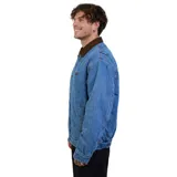 Campera de denim Volcom con cierre frontal y botones a presión, cuello de pana en color marrón y logo de la marca en el pecho.