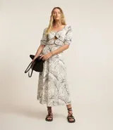 Vestido midi de viscosa y lino con estampado de hojas, escote corazón, mangas cortas abullonadas y recortes cut-out.