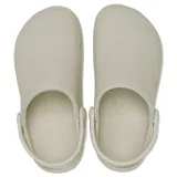 Zuecos Crocs modelo Classic Crafted Clog, de color beige, con parte superior de lona textil y suela de goma Croslite. Incluye correa de talón pivotante y detalles de la marca en el lateral.