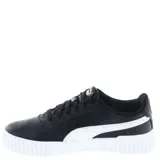 Championes urbanos Puma modelo Carina 2.0, color negro con la icónica franja lateral en blanco. Presentan una suela de plataforma de goma blanca con diseño texturizado y cierre mediante cordones.