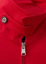 Chaqueta oversize de algodón con elastano, color rojo, de manga larga, con cuello camisero y cierre delantero con cremallera.