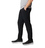 Pantalón técnico de senderismo color negro, con cintura elástica parcial, bolsillos laterales y bolsillo de seguridad con cierre. Cuenta con tecnología de repelencia al agua y protección solar.