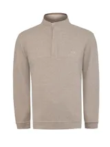 Sweater de tejido de punto color beige, con cuello alto y cierre frontal parcial con botones ocultos. Presenta un diseño de textura acanalada y un pequeño logo bordado en el pecho.