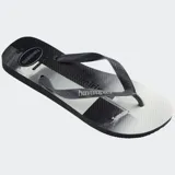 Ojotas Havaianas con base blanca y celeste con estampado de olas. Tiras blancas con diseño en relieve y logo de la marca.